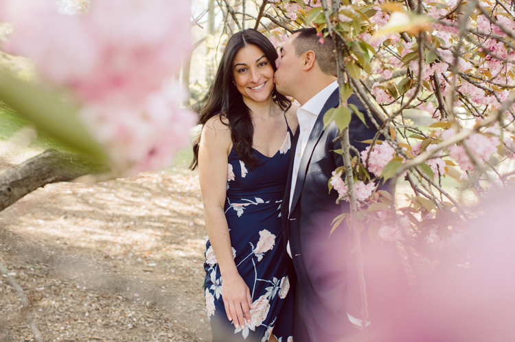 Bethesda Terrace Arcade in Central Park NY in my opinion alway so lovely. I saw Brianna and Joe standing in the middle of Bethesda Terrace next to the fountain. We walked right into the crowd of Central Park and started our engagement session. Cherry Blossoms were still in bloom along with all the spring blooms. Spring sun was brilliant and smiles on Brianna and Joe during the engagement session was so beautiful. Brianna and Joe's Bethesda Terrace Arcade in Central Park NY engagement session captured by NY NJ Weddings, Elopements and Family Photographer Karis.